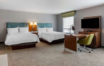 Day use twin suite with work station, lounge area and private bathroom at Hampton Inn & Suites By Hilton Edmonton/West.