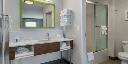 Private bathroom with shower and free toiletries at Hampton Inn & Suites By Hilton Edmonton/West.