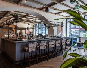 Stylish restaurant area at The Westley Calgary Downtown, Tapestry Collection By Hilton.