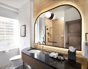 Private bathroom with shower and free toiletries at The Westley Calgary Downtown, Tapestry Collection By Hilton.