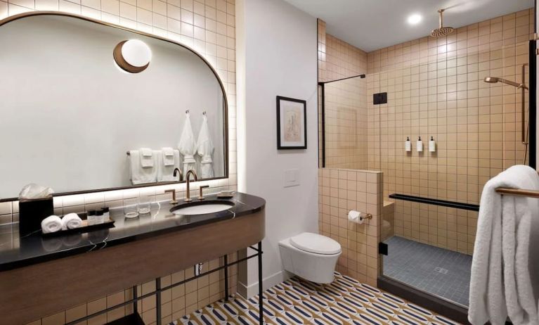 Private bathroom with shower and free toiletries at The Westley Calgary Downtown, Tapestry Collection By Hilton.