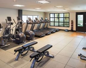 Fully equipped fitness center at Hilton Winnipeg Airport Suites.