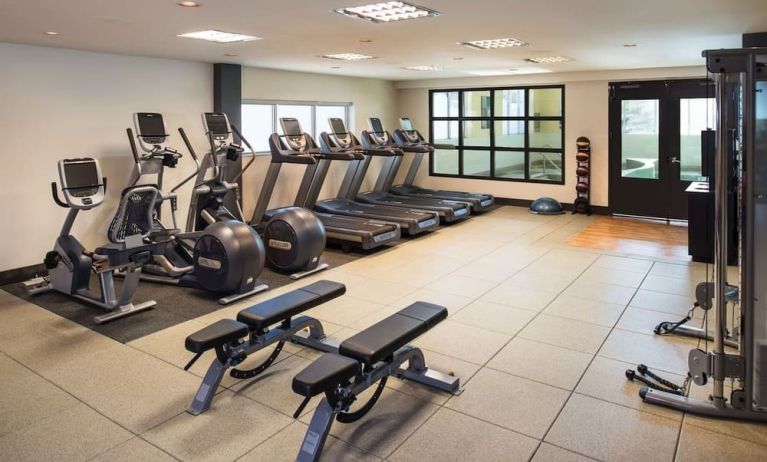 Fully equipped fitness center at Hilton Winnipeg Airport Suites.