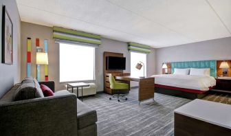 Day use studio suite with work station, lounge area and lounge area at the  Hampton Inn & Suites By Hilton Guelph.