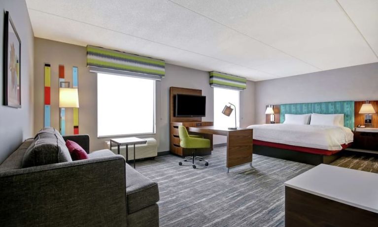 Day use studio suite with work station, lounge area and lounge area at the  Hampton Inn & Suites By Hilton Guelph.