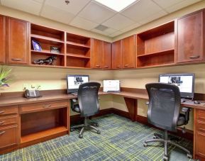 Professional business center with compuerts, printer and ergonomic chairs at the  Hampton Inn & Suites By Hilton Guelph.