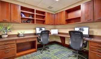 Professional business center with compuerts, printer and ergonomic chairs at the  Hampton Inn & Suites By Hilton Guelph.