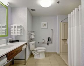 Private guest bathroom with shower and free toiletries at the  Hampton Inn & Suites By Hilton Guelph.