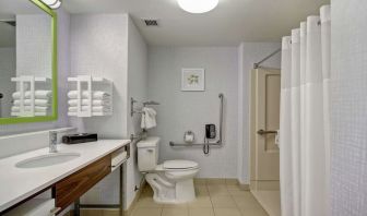 Private guest bathroom with shower and free toiletries at the  Hampton Inn & Suites By Hilton Guelph.