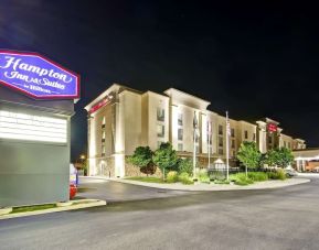 Hotel exterior and parking area at the  Hampton Inn & Suites By Hilton Guelph.