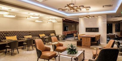 Dining area with comfortable seating, perfect for co-working at DoubleTree By Hilton Kitchener.