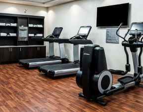 Fitness center with treadmills and machines  at DoubleTree By Hilton Kitchener.