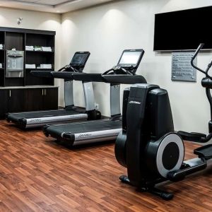 Fitness center with treadmills and machines  at DoubleTree By Hilton Kitchener.