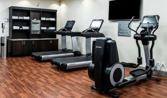 Fitness center with treadmills and machines  at DoubleTree By Hilton Kitchener.