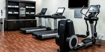 Fitness center with treadmills and machines  at DoubleTree By Hilton Kitchener.