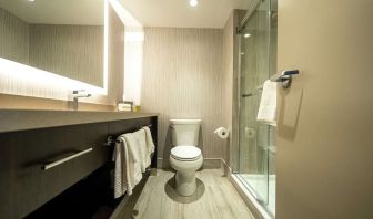 Private guest bathroom with shower and free toiletries at DoubleTree By Hilton Kitchener.