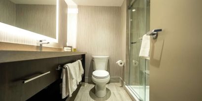 Private guest bathroom with shower and free toiletries at DoubleTree By Hilton Kitchener.