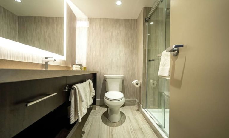 Private guest bathroom with shower and free toiletries at DoubleTree By Hilton Kitchener.