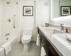 Private bathroom with tub and free toiletries  at DoubleTree By Hilton Kitchener.