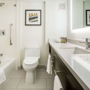 Private bathroom with tub and free toiletries  at DoubleTree By Hilton Kitchener.