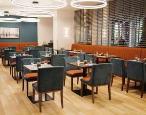 Hotel dining area with comfortable seating at the Hilton Garden Inn Fredericton.