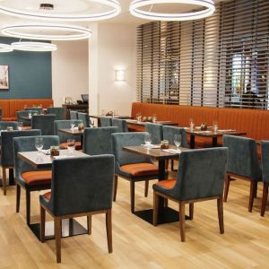 Hotel dining area with comfortable seating at the Hilton Garden Inn Fredericton.