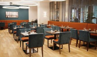 Hotel dining area with comfortable seating at the Hilton Garden Inn Fredericton.