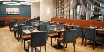 Hotel dining area with comfortable seating at the Hilton Garden Inn Fredericton.