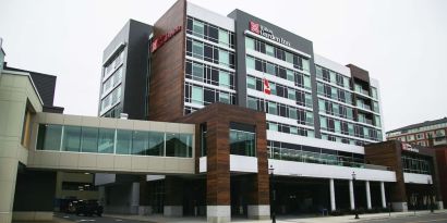 Hotel exterior and parking area at the Hilton Garden Inn Fredericton.