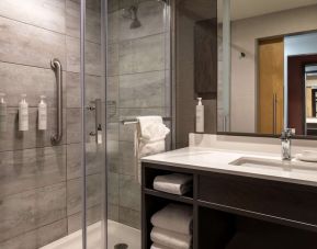 Private guest bathroom with shower and free toiletries at the Hilton Garden Inn Fredericton.