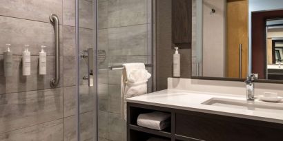 Private guest bathroom with shower and free toiletries at the Hilton Garden Inn Fredericton.