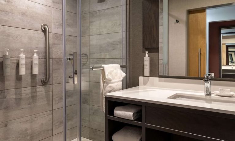 Private guest bathroom with shower and free toiletries at the Hilton Garden Inn Fredericton.