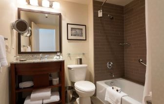 Guest bathroom with shower and tub at Fairmont Winnipeg.