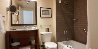 Guest bathroom with shower and tub at Fairmont Winnipeg.