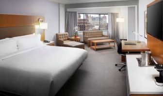 Day use room with work desk and sofa at Hilton Albany.
