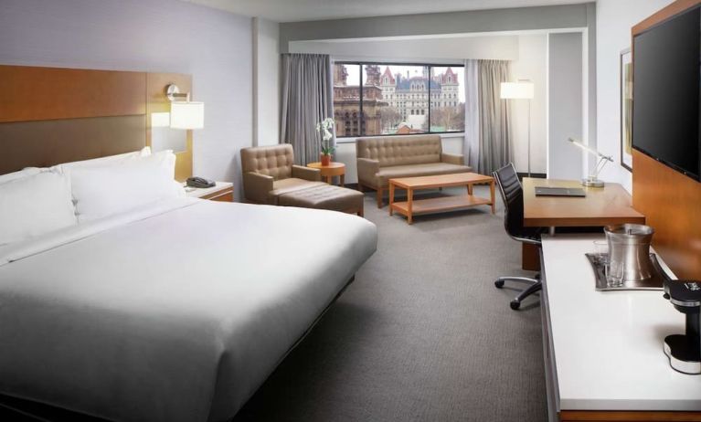 Day use room with work desk and sofa at Hilton Albany.
