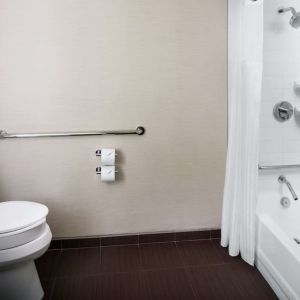 Guest bathroom with shower and tub at Hilton Albany.
