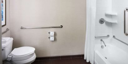 Guest bathroom with shower and tub at Hilton Albany.
