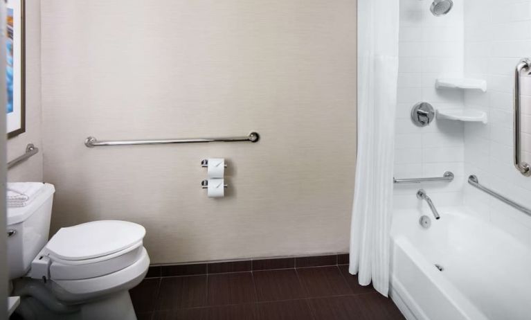 Guest bathroom with shower and tub at Hilton Albany.
