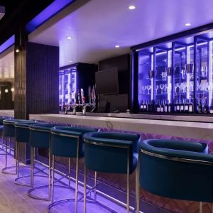 Hotel bar with lounge chairs at the Embassy Suites By Hilton Toronto Airport.