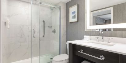 Private guest bathroom with shower at the Embassy Suites By Hilton Toronto Airport.