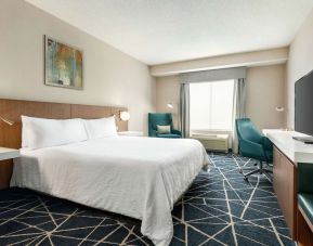 Day use room with TV, work desk and sofa at the Hilton Garden Inn Kitchener/Cambridge.