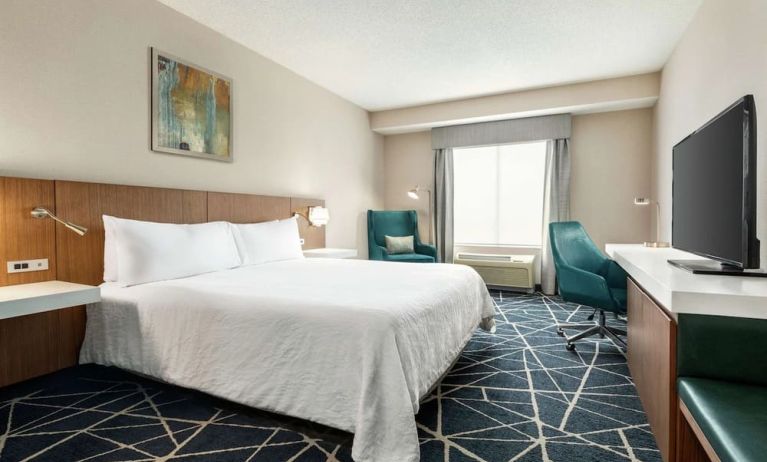 Day use room with TV, work desk and sofa at the Hilton Garden Inn Kitchener/Cambridge.