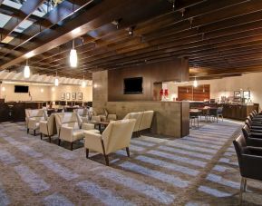 Hotel dining area with comfortable seating perfect for co-working at the Holiday Inn Oakville Centre.