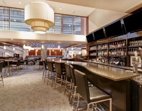 Hotel bar with comfortable seating at the Holiday Inn Oakville Centre.