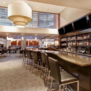 Hotel bar with comfortable seating at the Holiday Inn Oakville Centre.