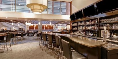 Hotel bar with comfortable seating at the Holiday Inn Oakville Centre.