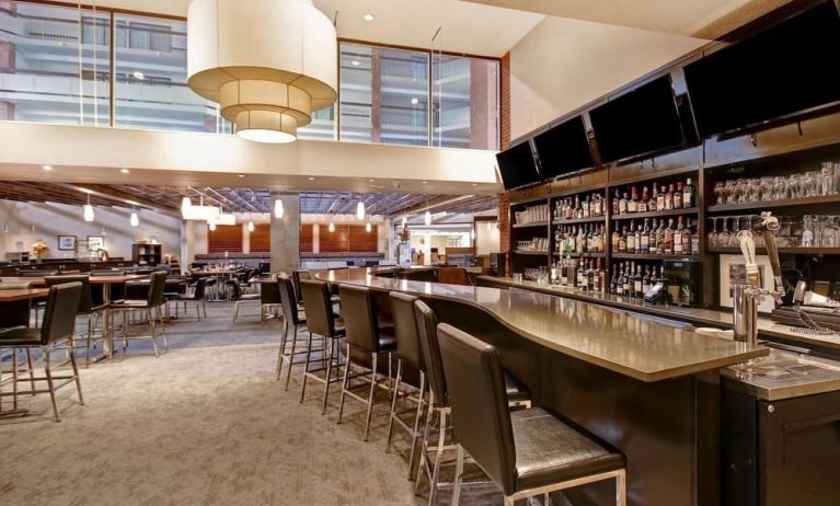 Hotel bar with comfortable seating at the Holiday Inn Oakville Centre.