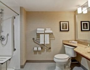 Private guest bathroom with shower and free toiletries at the Holiday Inn Oakville Centre.
