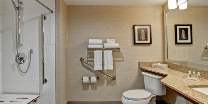 Private guest bathroom with shower and free toiletries at the Holiday Inn Oakville Centre.
